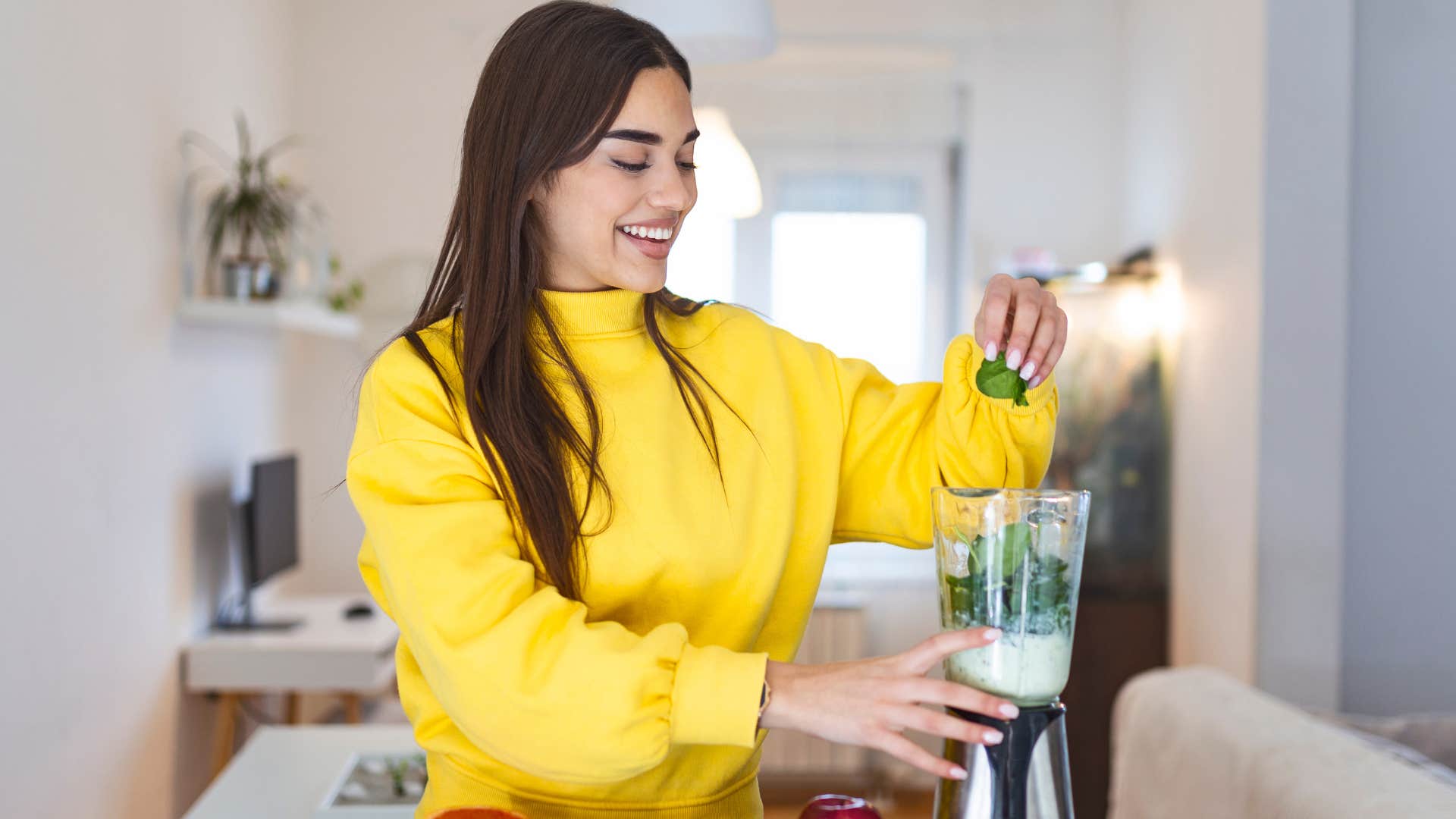 woman using unnecessary appliances in her kitchen