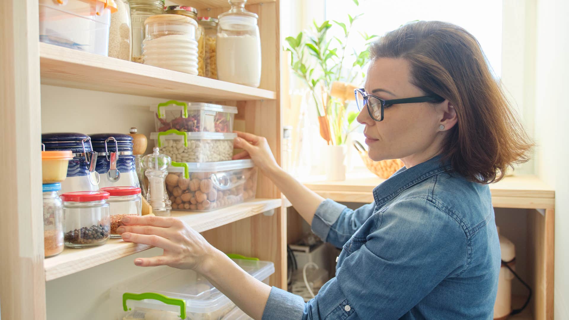 woman stocking her pantry with high quality necessities