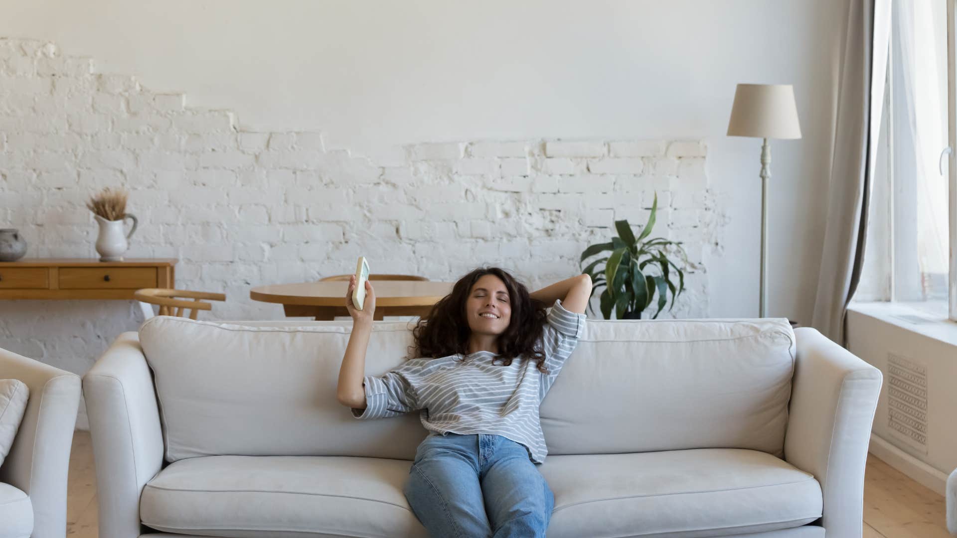 woman sitting in her sterile and clean living room