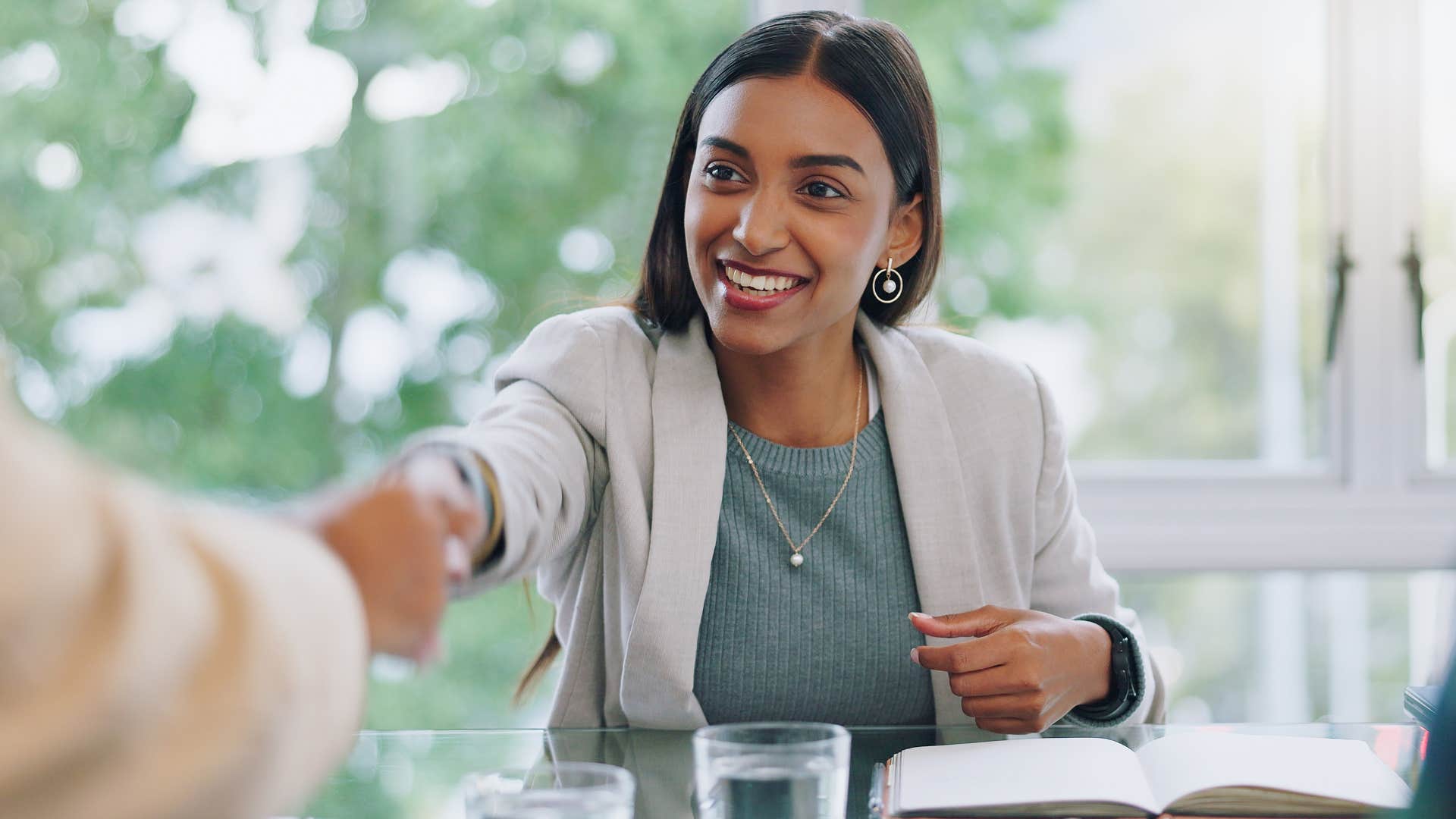 woman who knows everyone's time is important shaking a man's hand