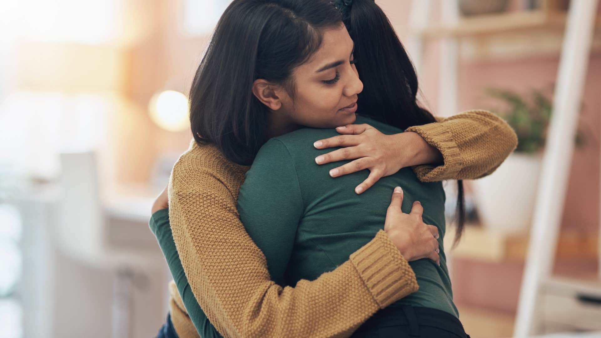 two women hugging goodbye
