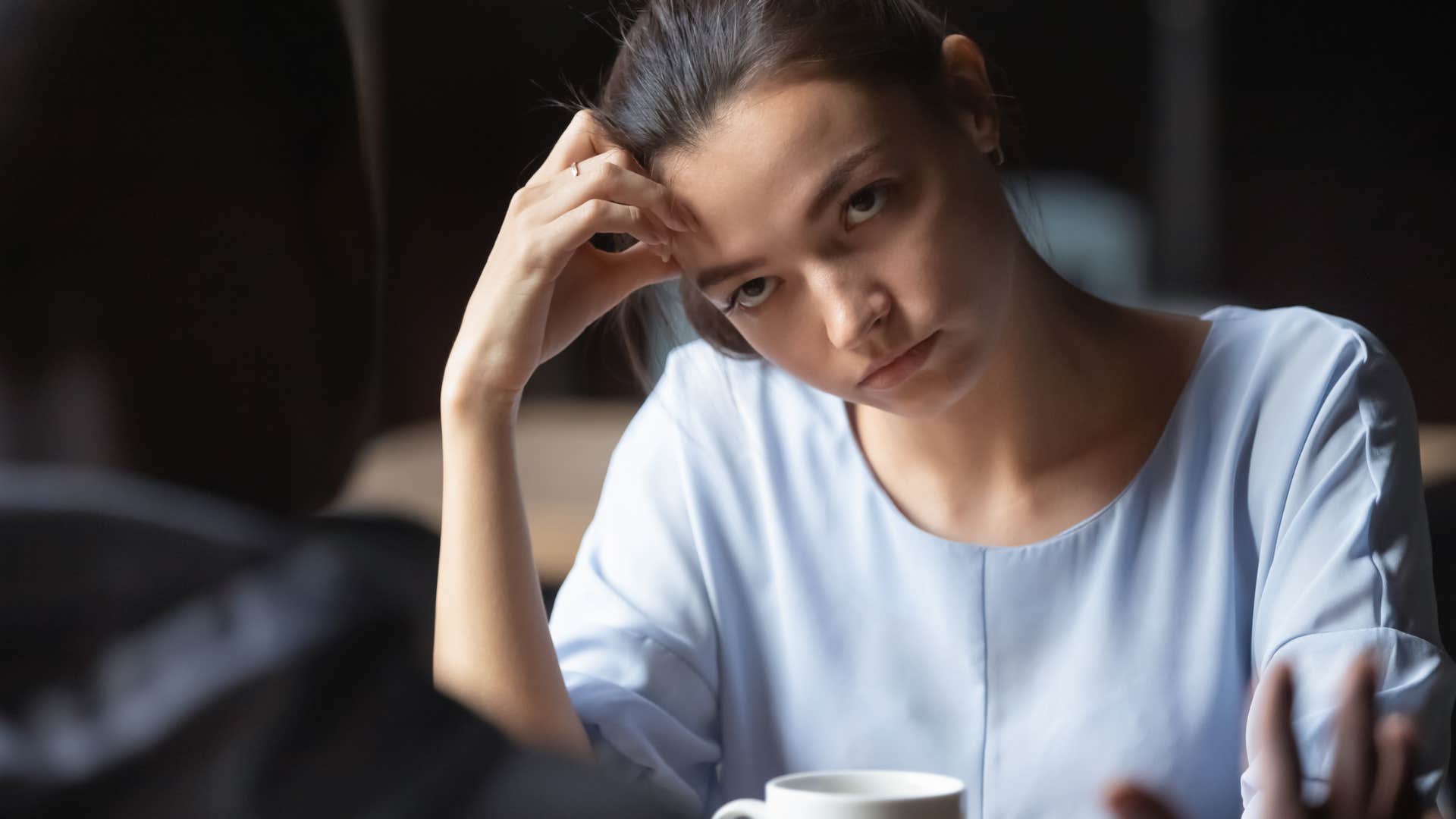 introverted woman struggling to have a conversation with date