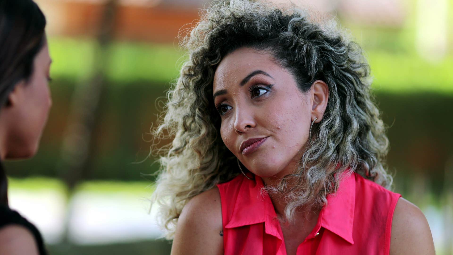 introverted woman putting thought into her response in conversation