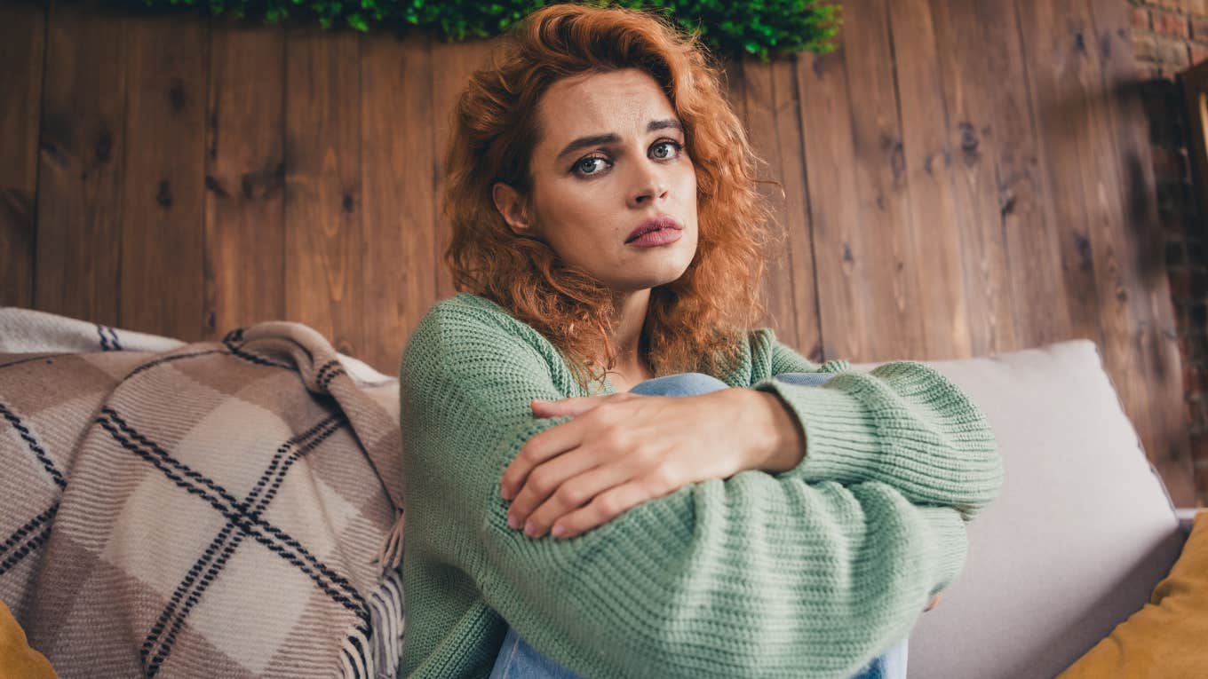 Traits Introverts Who Have A Hard Time Finding Love Usually Have introverted woman sitting at home upset about her love life