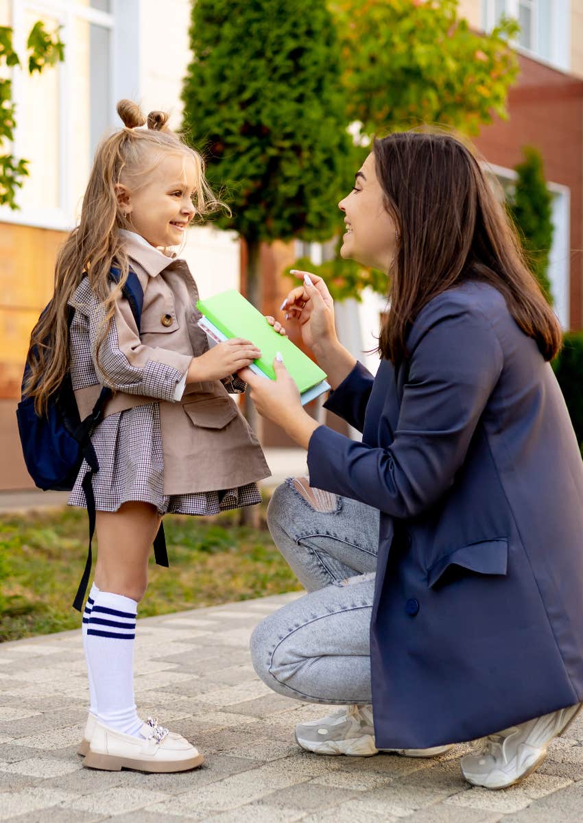 mom giving her daughter trendy school supplies for the new year
