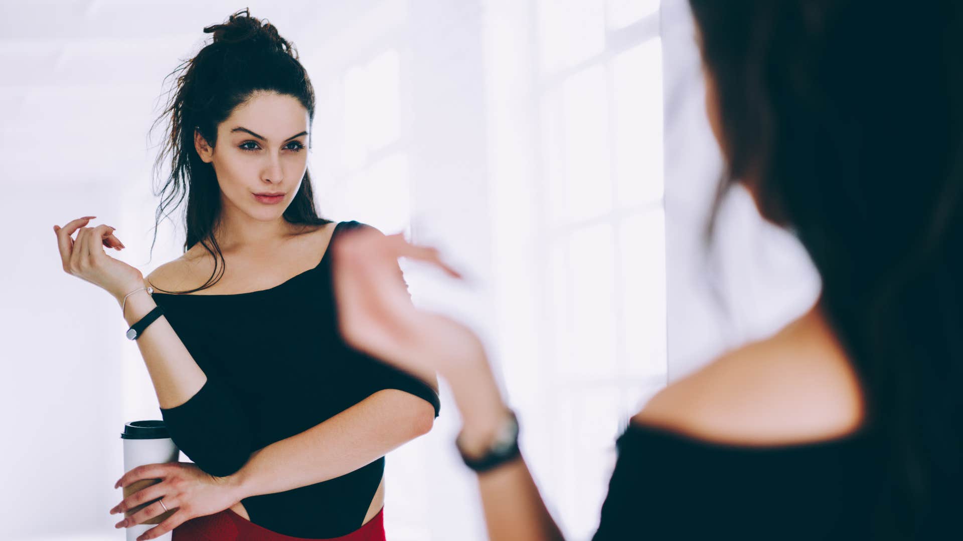 narcissistic woman looking in the mirror