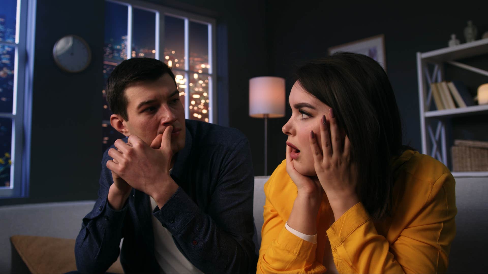 man interrupting his girlfriend when she speaks