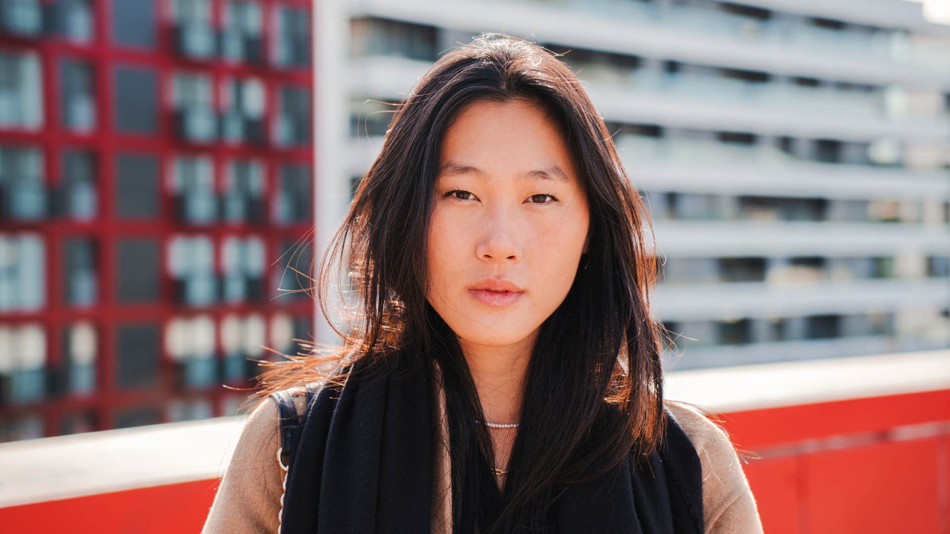 front view of woman looking at camera on rooftop