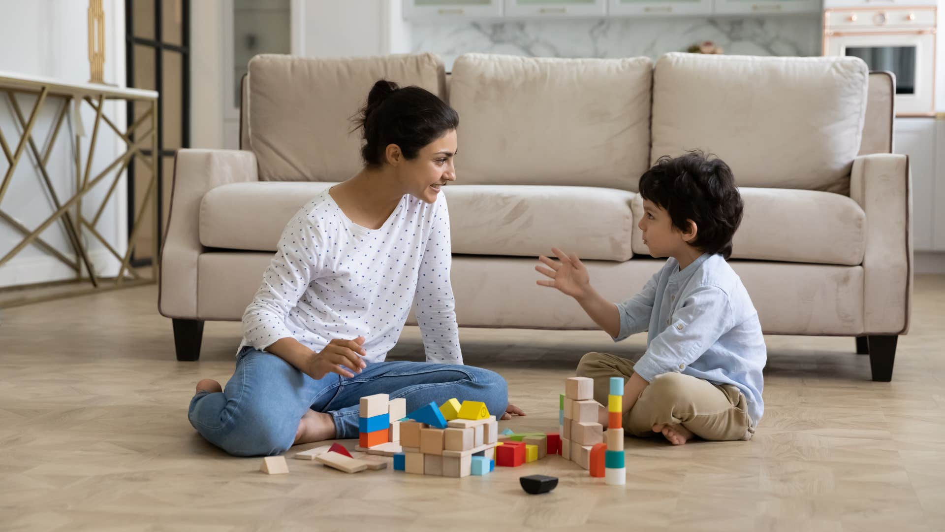 woman who is teaching child so he can respect her when he's older