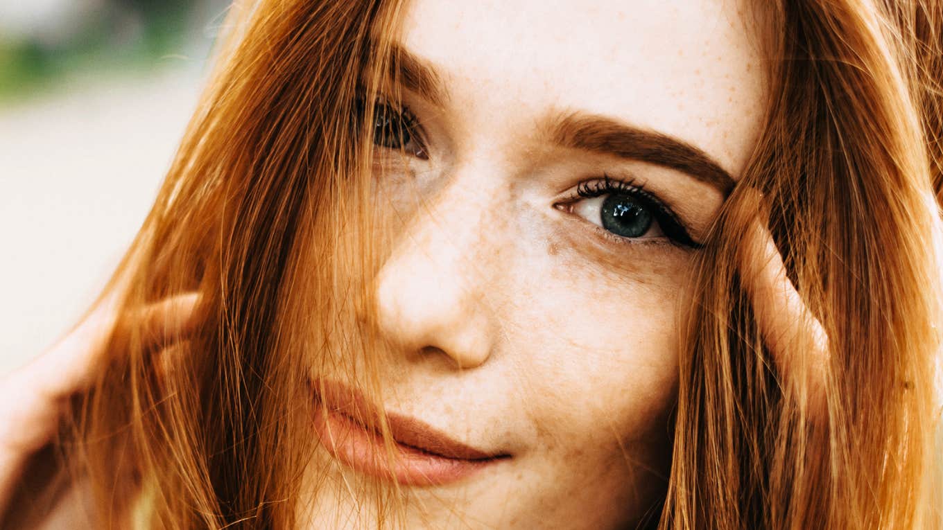 Ways To Do A 'Hard Reset' On Your Life After A Bad Breakup Woman doing a hard reset after a bad breakup.