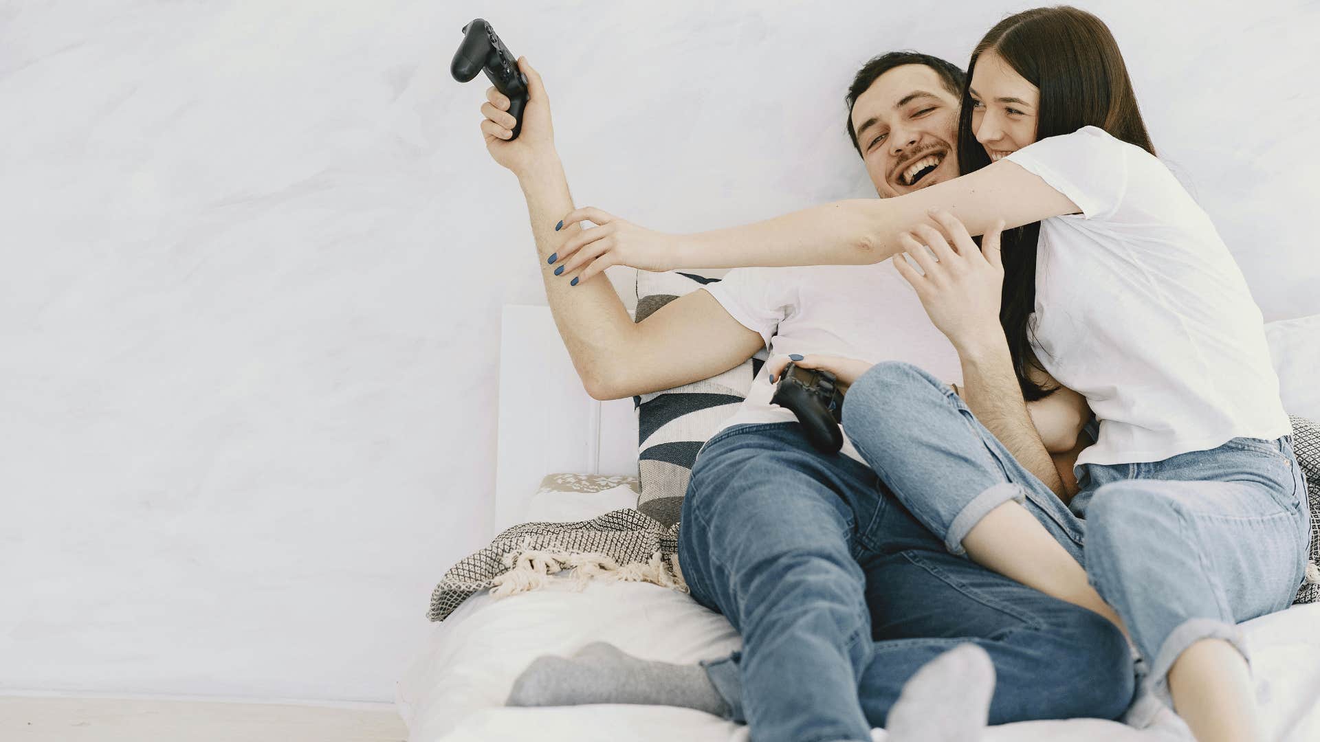 happy couple playing video games