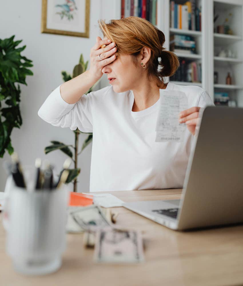 woman paying bills love trillion dollar lie still necessary