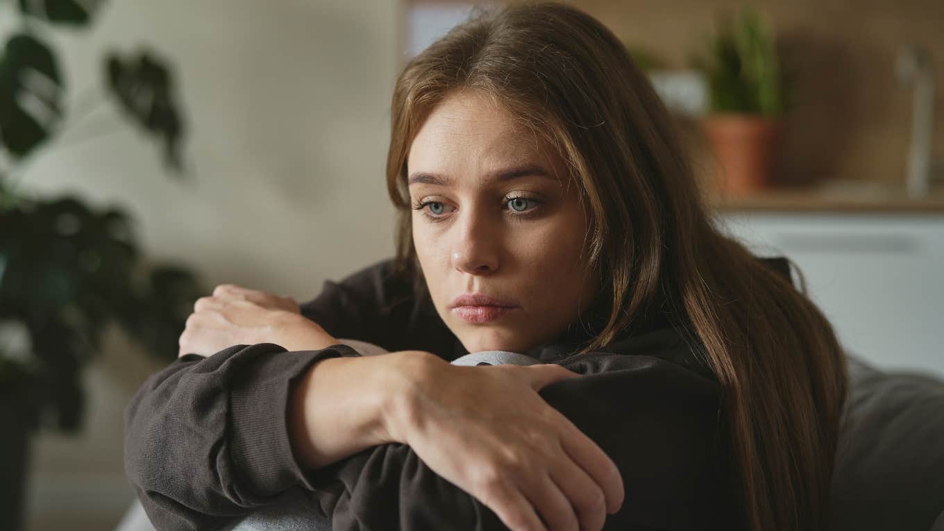 Woman looks sad.