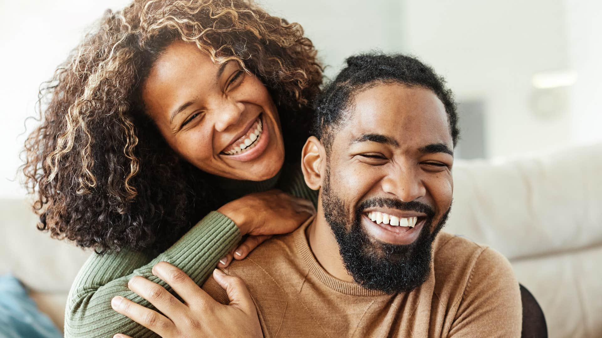 man making woman laugh