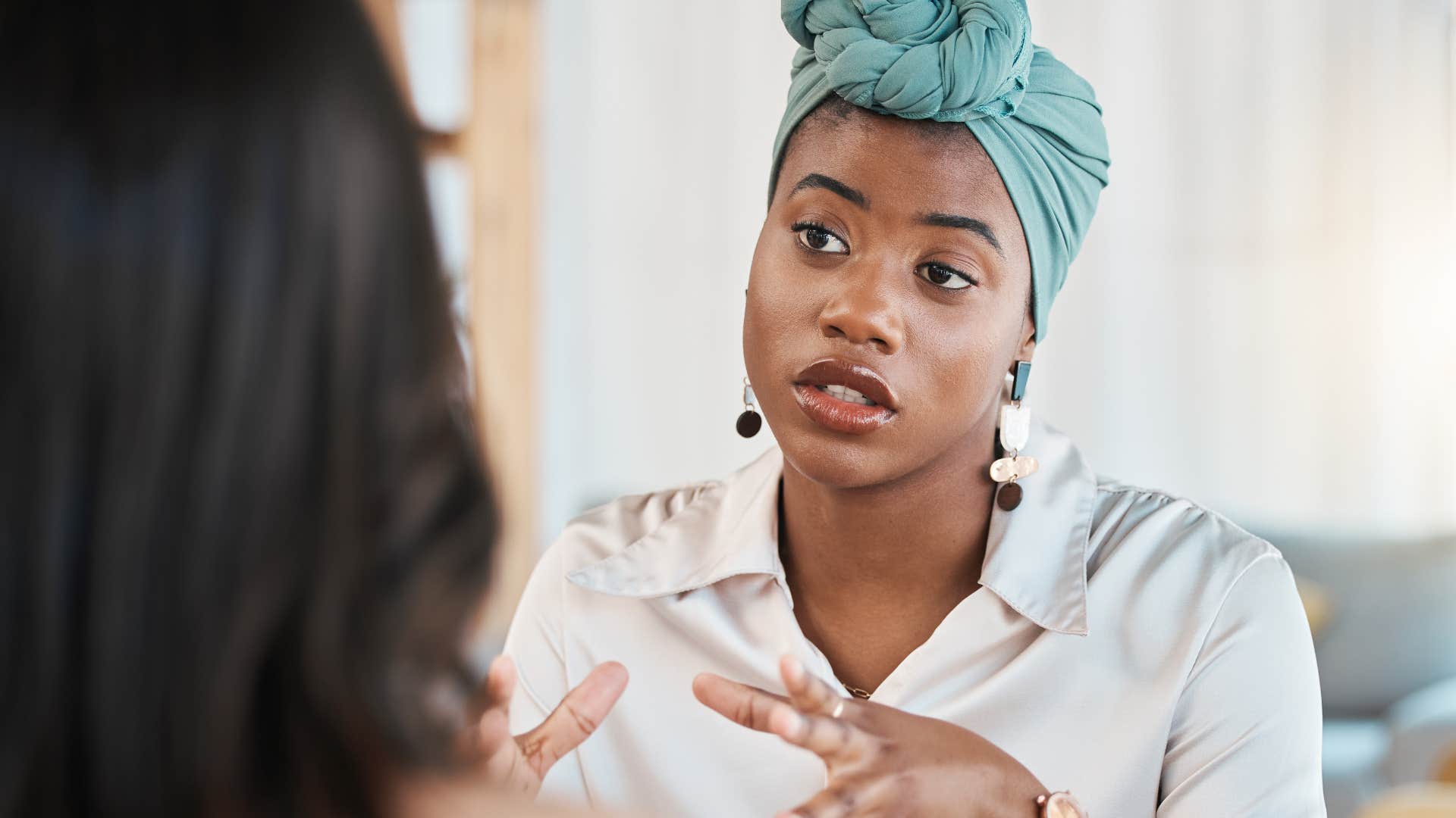 woman talking about entitlement with a co-worker