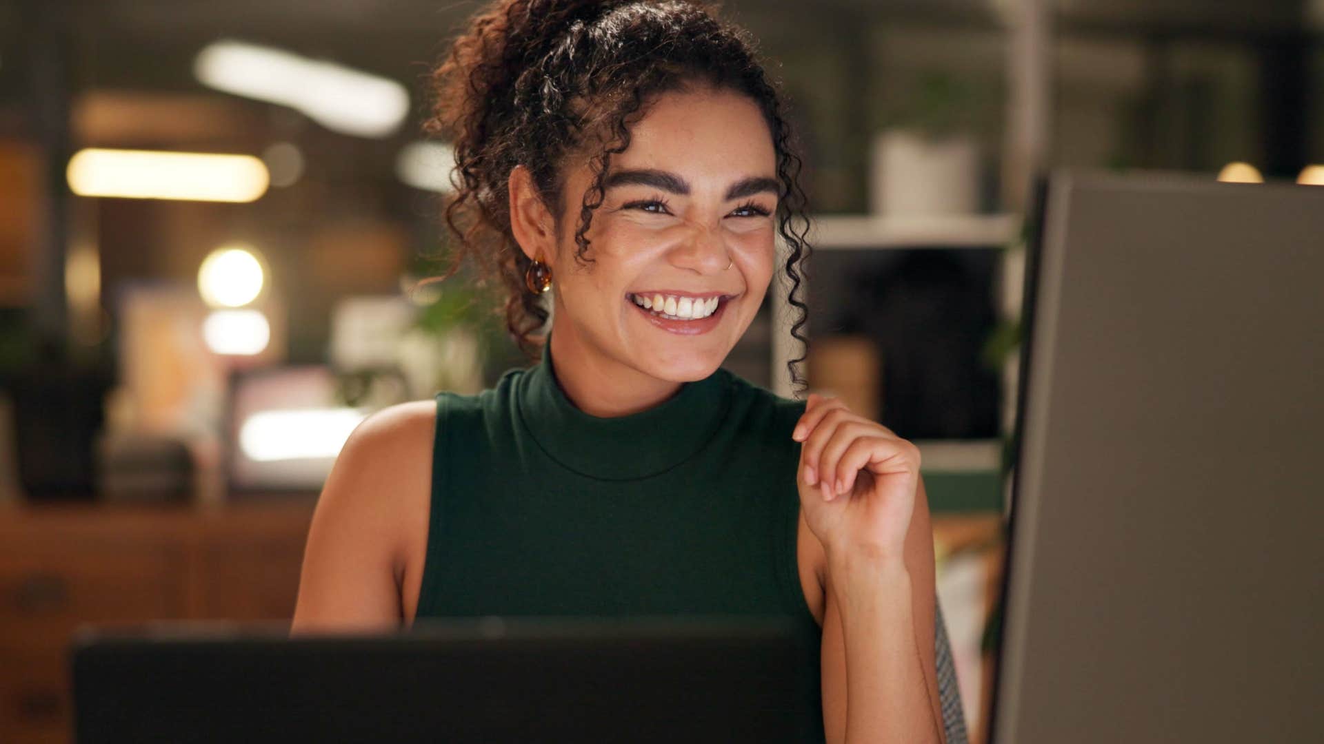 woman with toxic positivity smiling at work