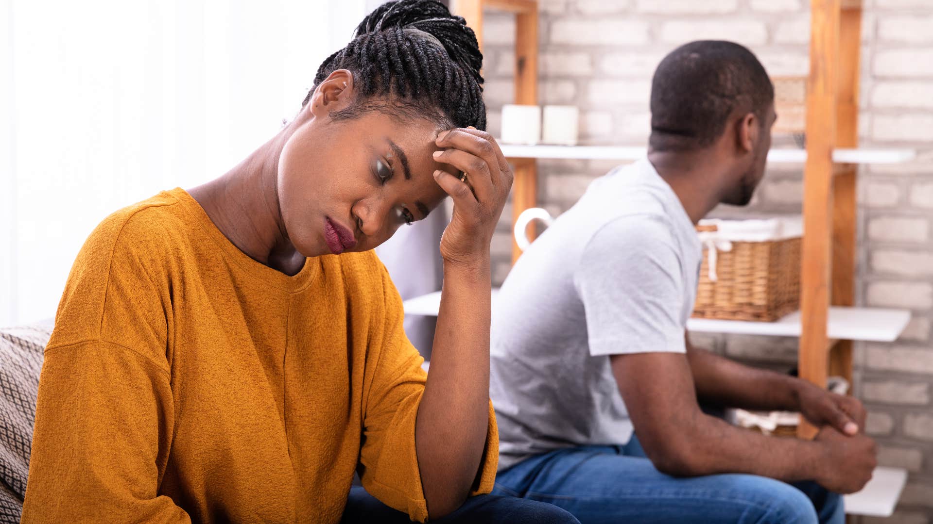 woman who doesn't feel supported turned away from her husband
