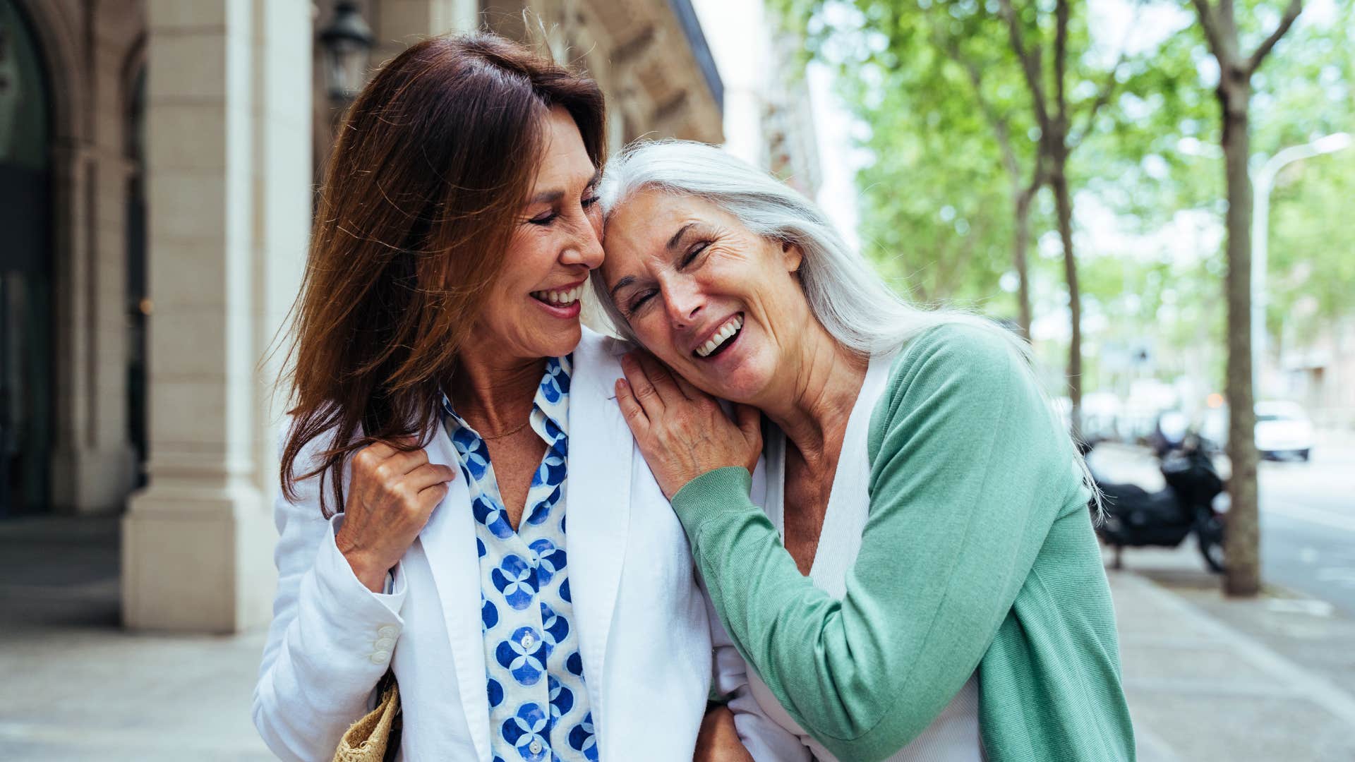 two women walking together outside