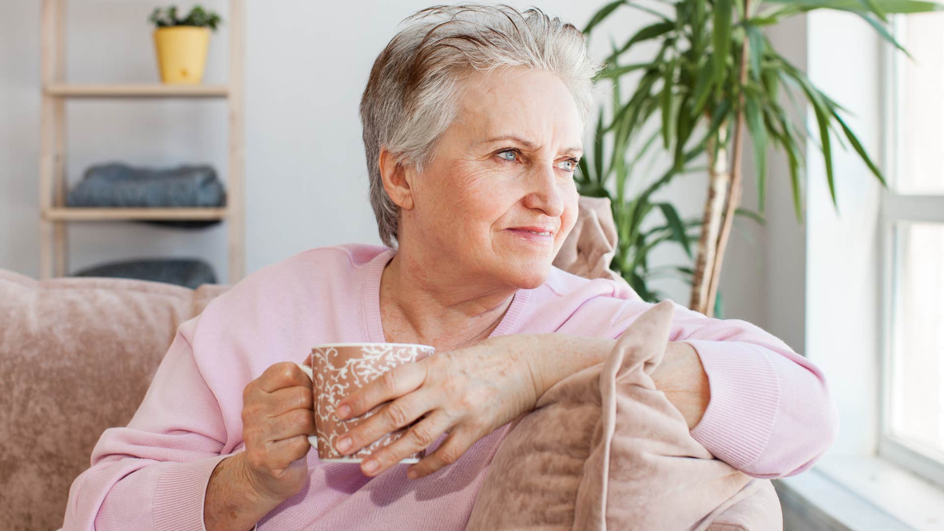 intuitive woman trusting her gut drinking coffee