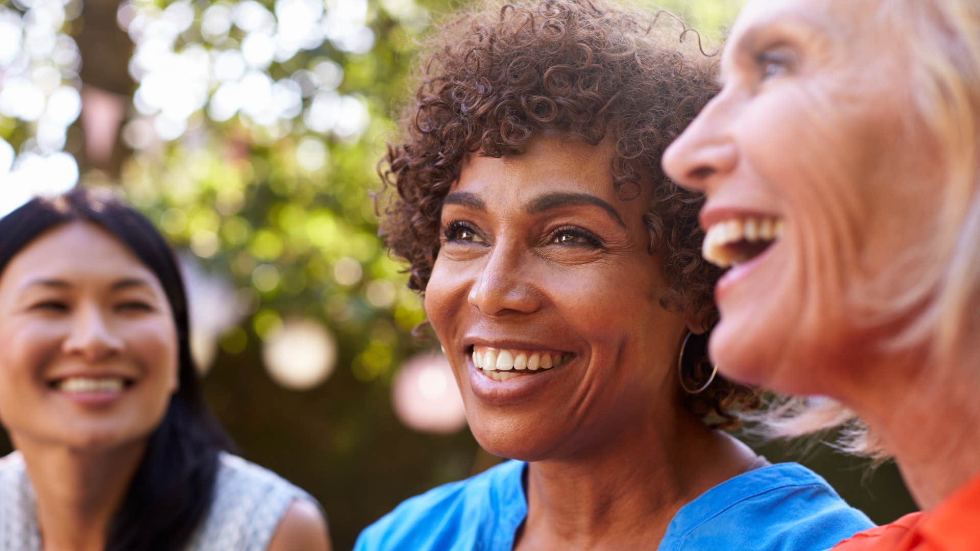 women who don't compete with others smiling together