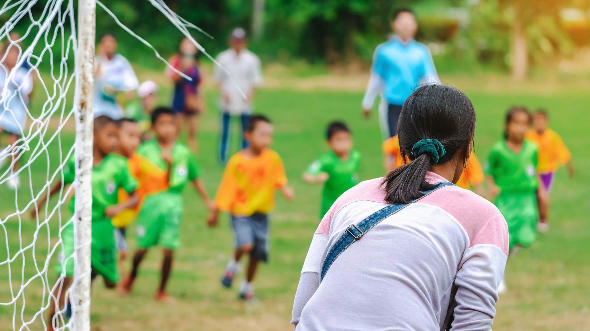 mom who is always at her kid's big events like sports games