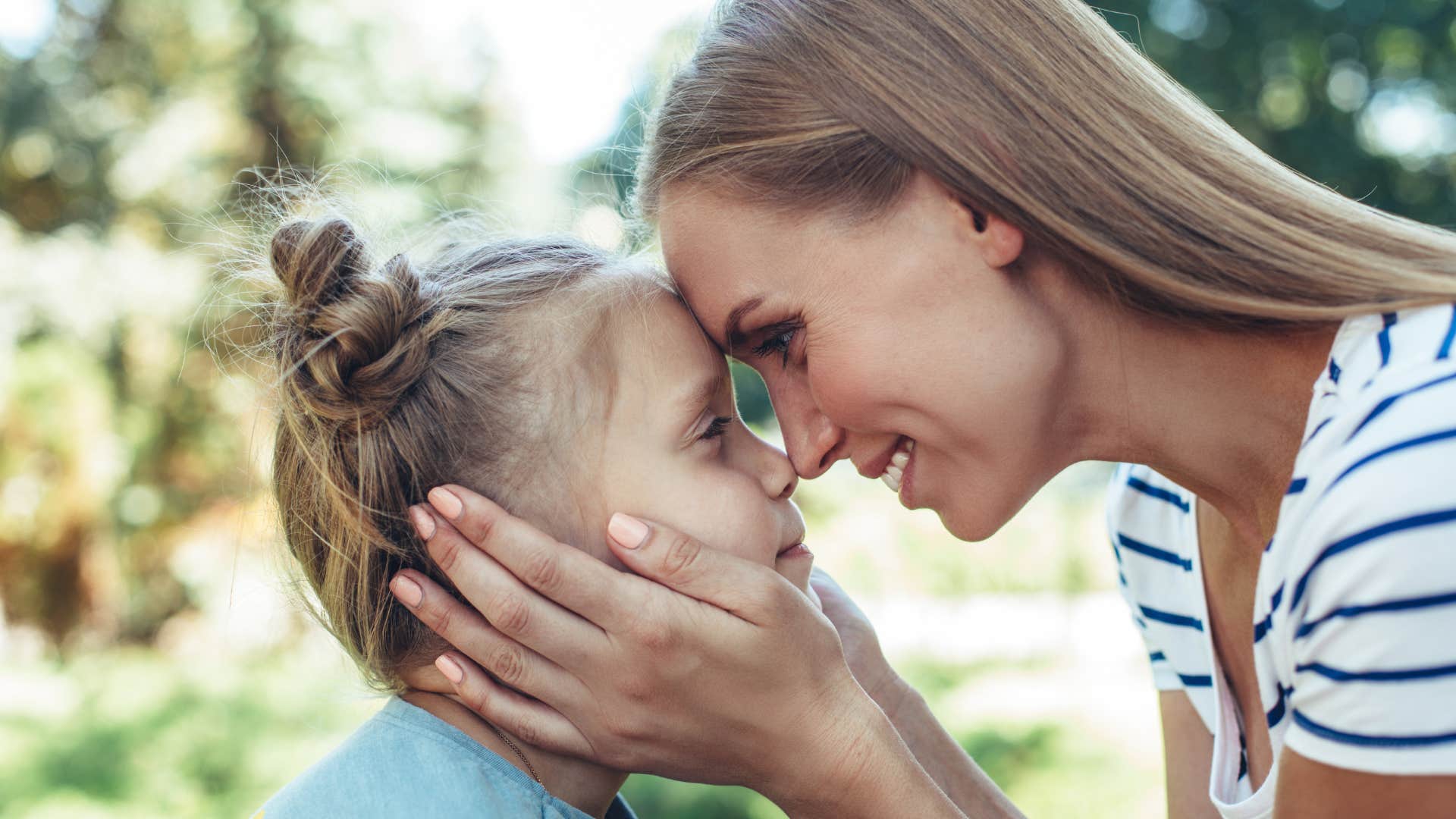 mom telling her daughter that she loves her and is proud of her