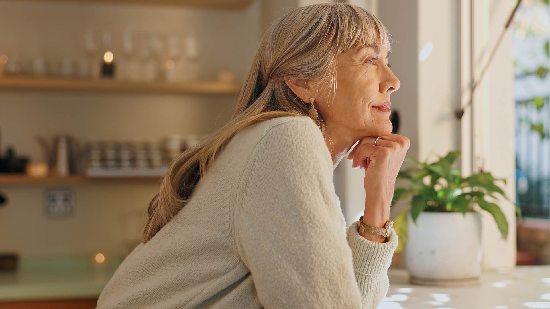 Woman having free time to relax in her home.