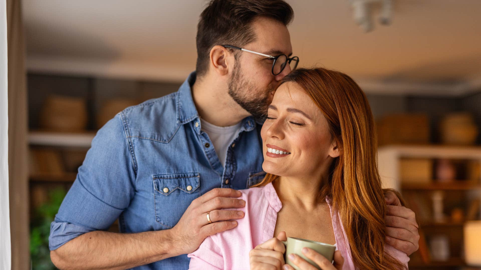 couple emotionally supporting one another at home
