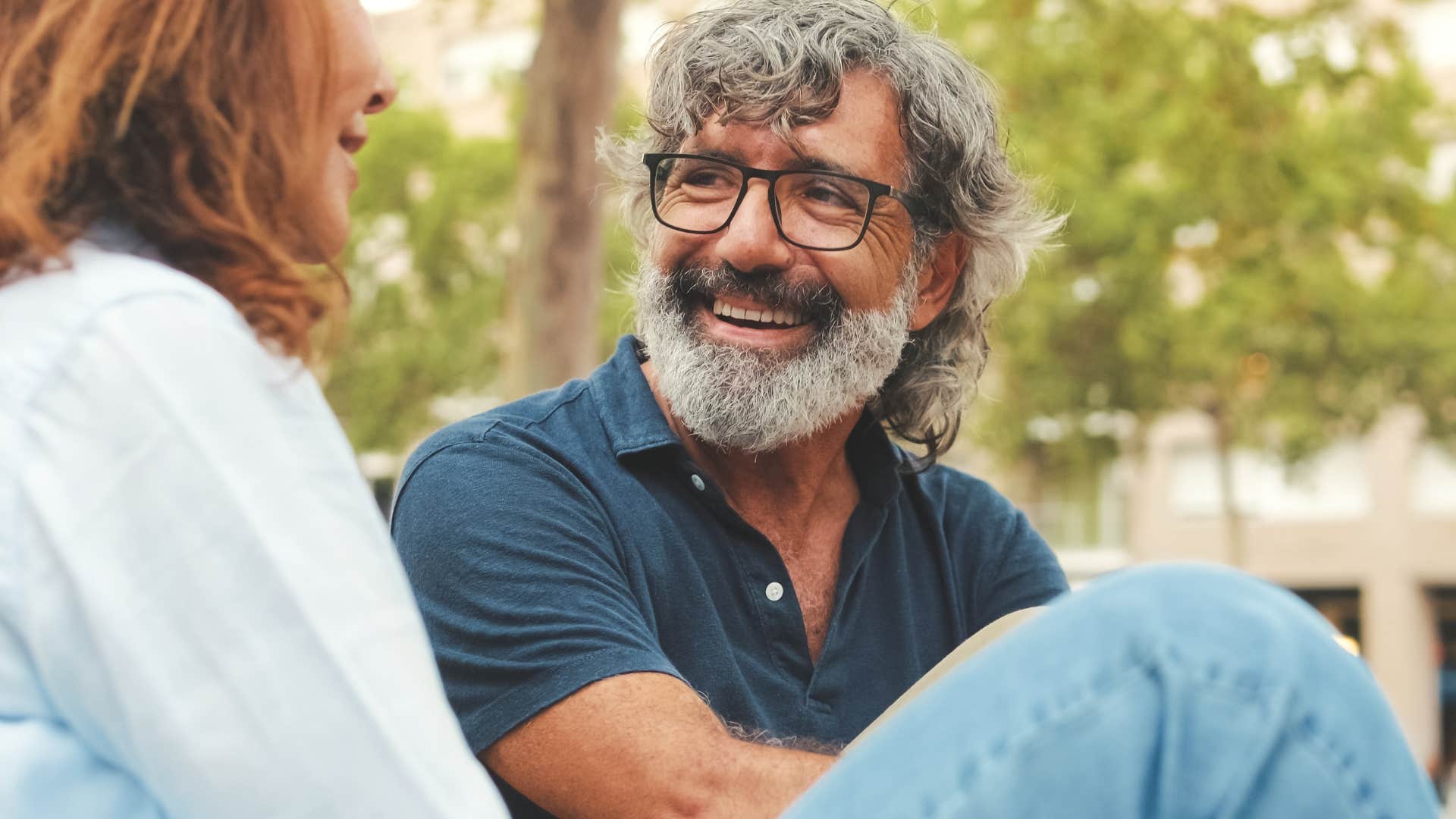couple smiling and handling stress outside together