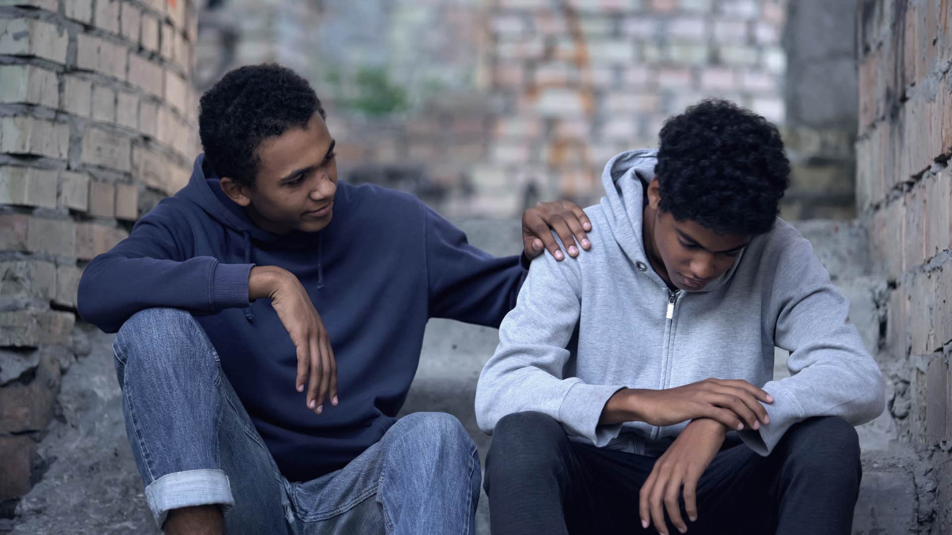 man supporting his friend