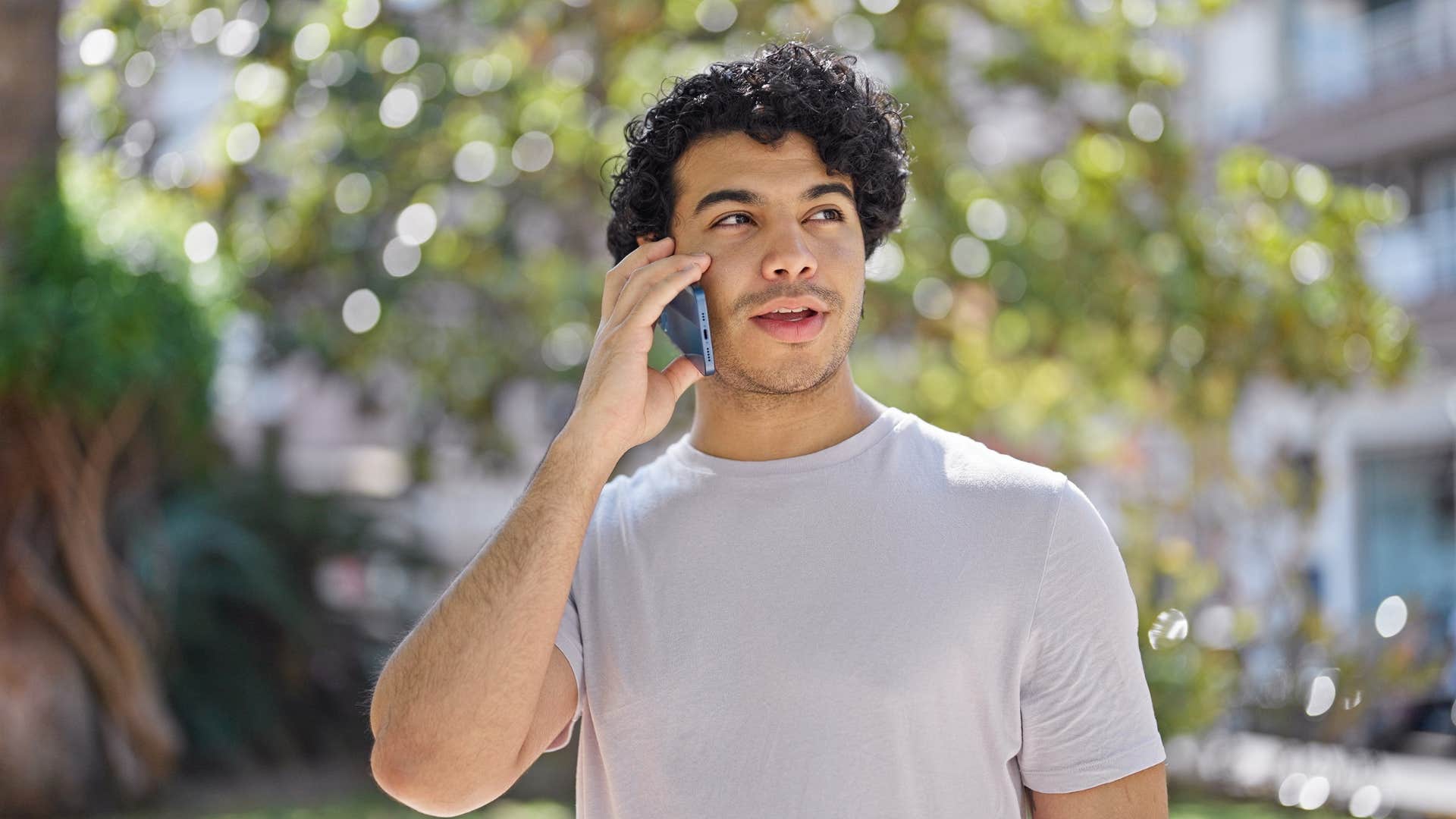 man talking on the phone outside