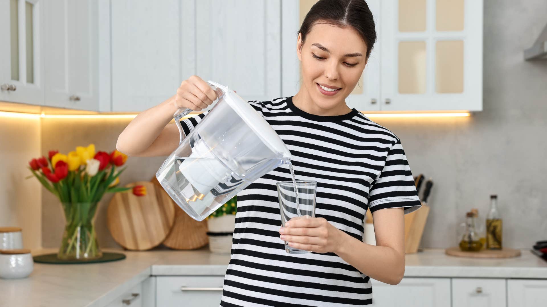 woman using a water filter