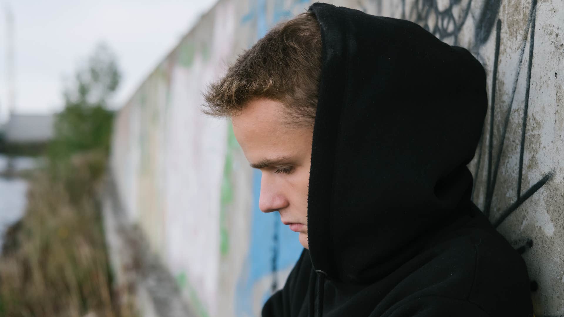 a young man does not communicate with his parents after years of abuse