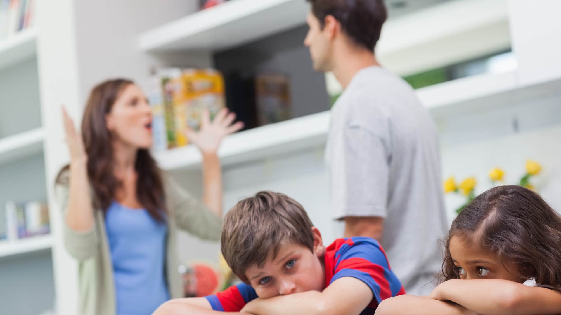 two siblings overhear their parents arguing over them
