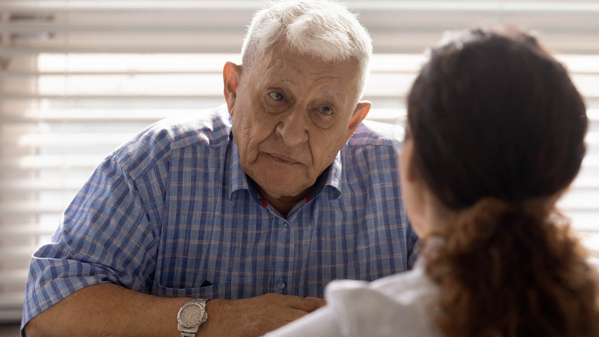 woman saying age is just a number to her upset older father