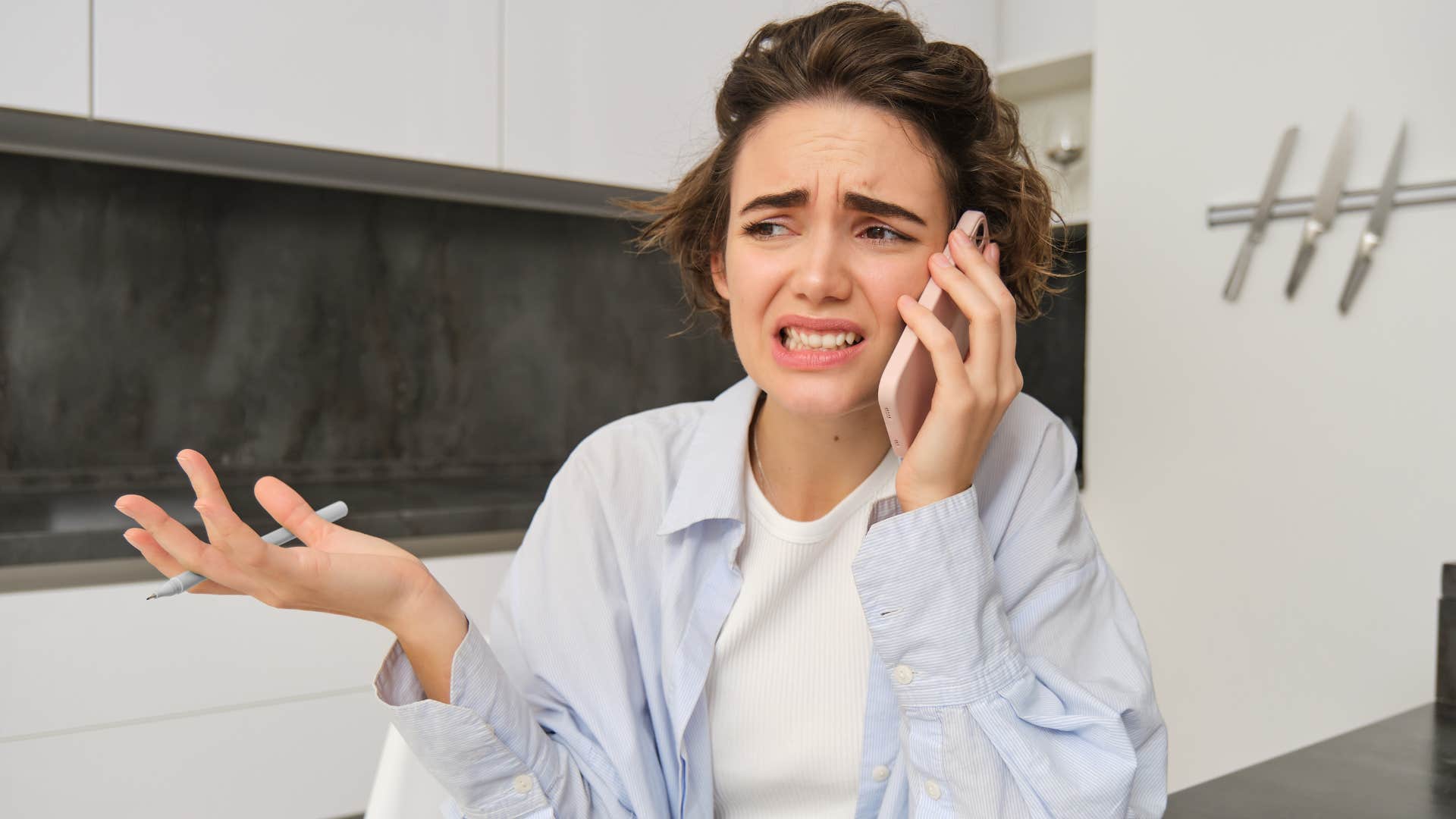 Woman saying "you probably think I'm weird" on the phone.