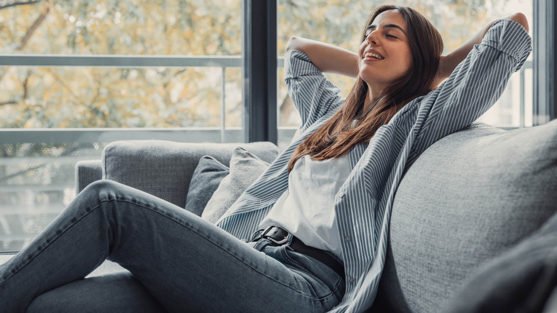 woman prefers to be alone compared to social gatherings as she relaxes on couch