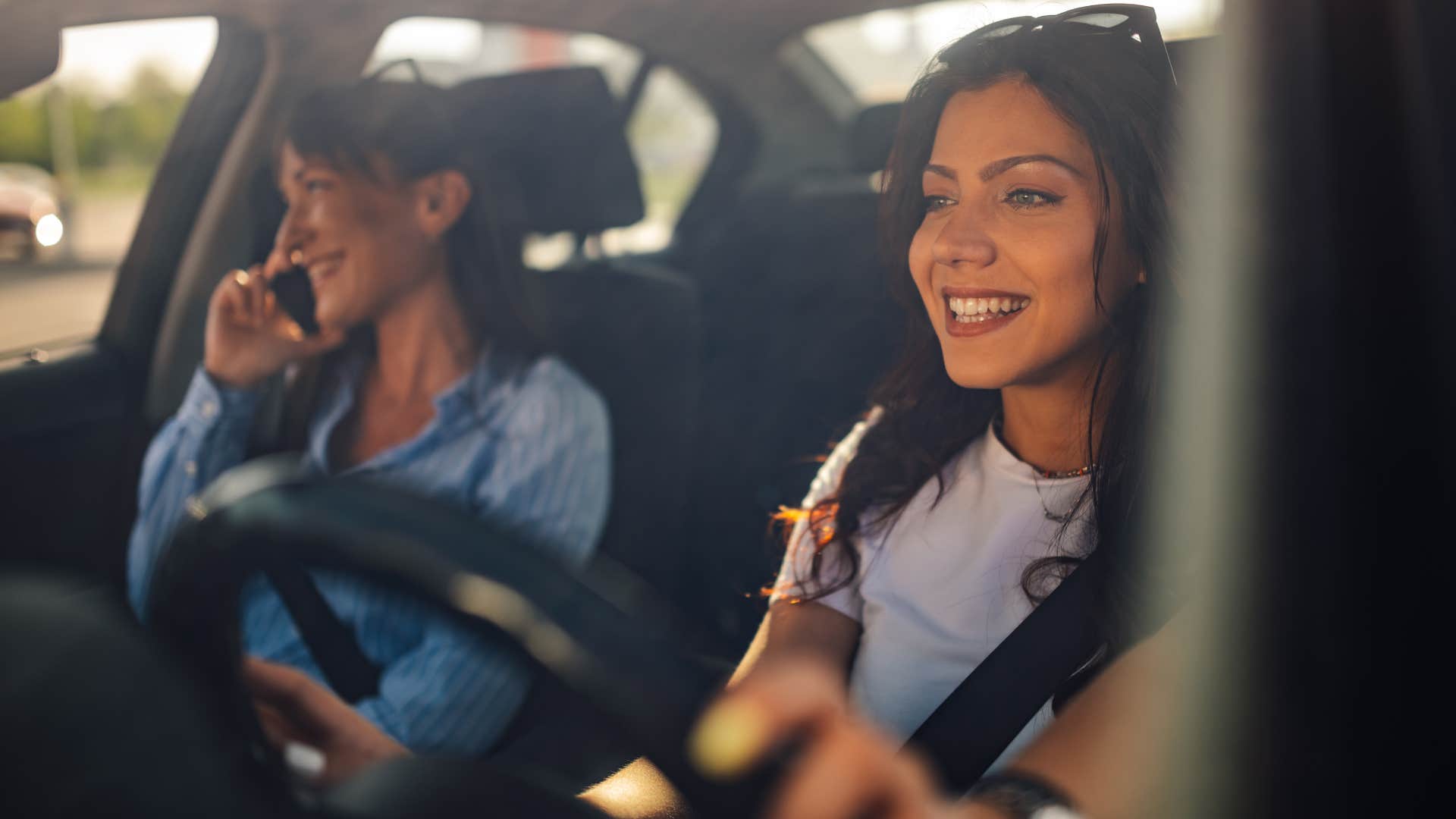 woman giving friend ride in car
