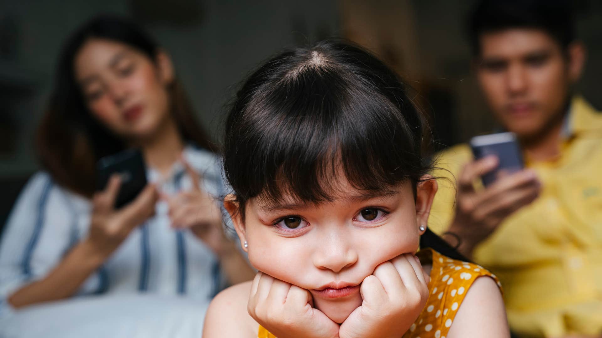 a young girl is ignored by her parents too much