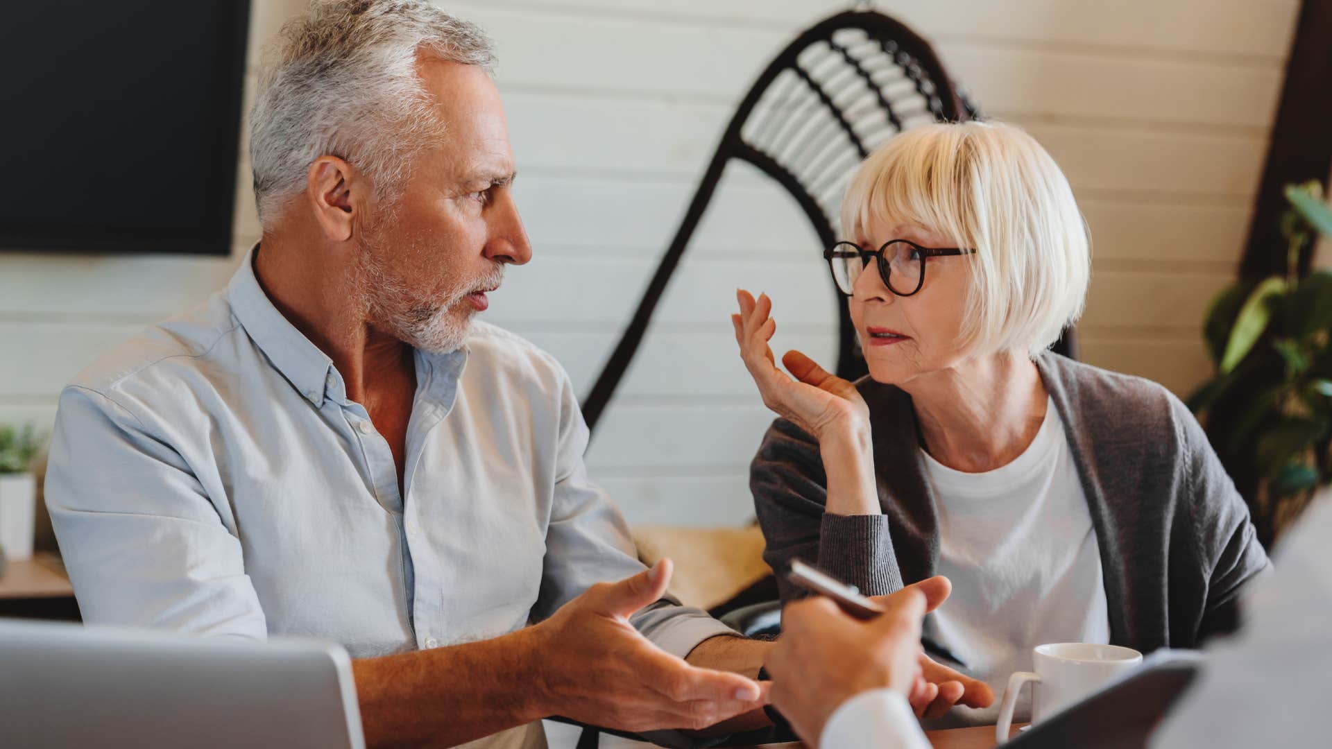 unhappy wife giving backhanded compliments to her husband