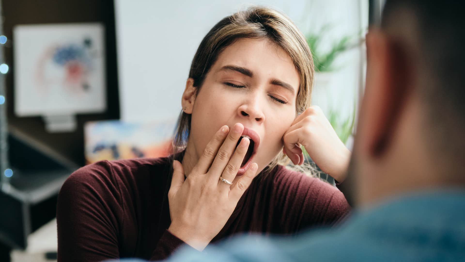 unhappy wife whose indifference is obvious yawning