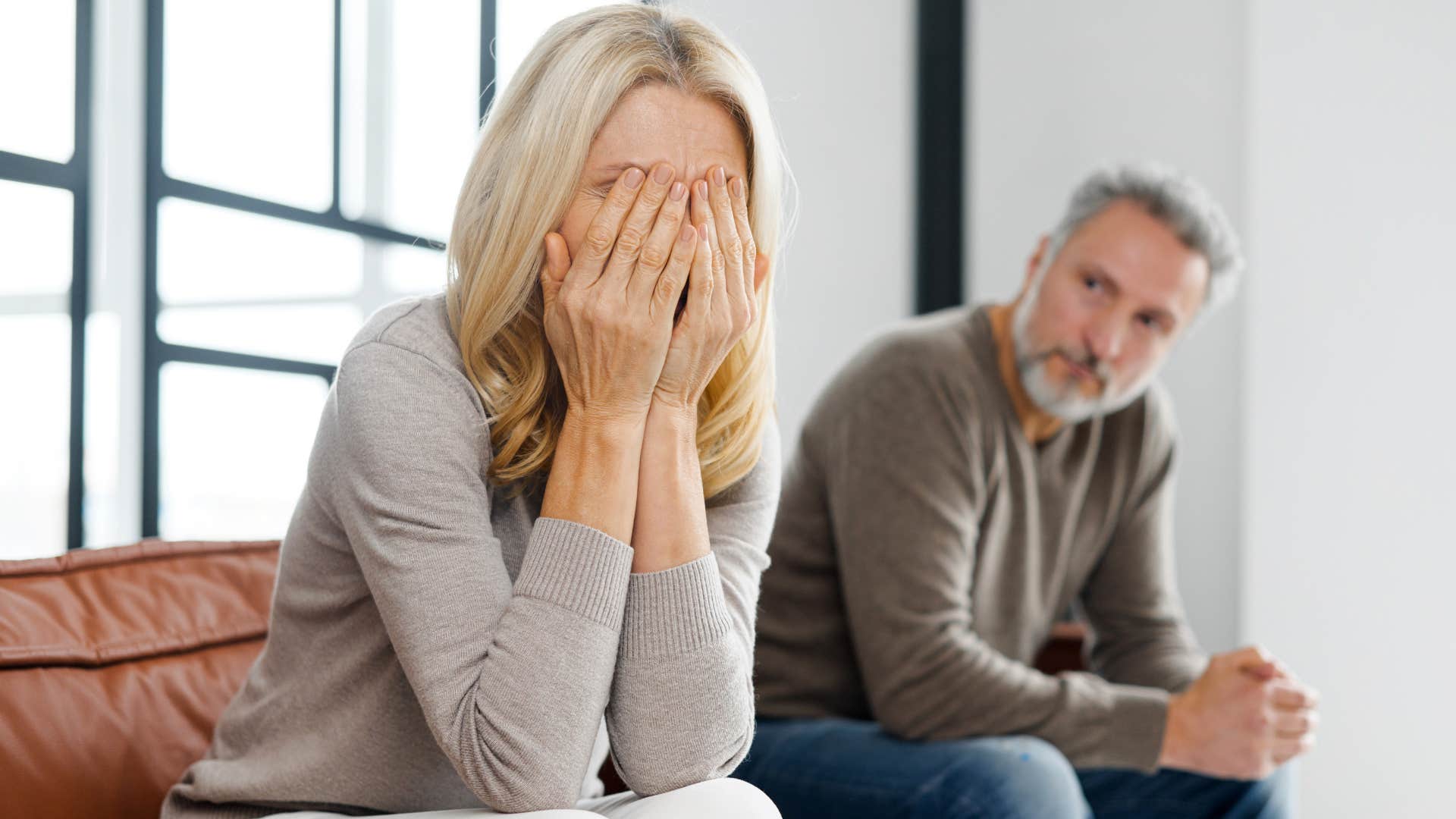unhappy wife stonewalling her husband at home