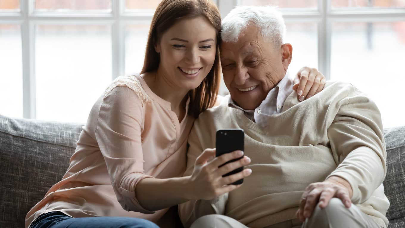 Bride's Grandfather Walks Laps In The Driveway So He Is Ready To Walk Her Down The Aisle bride and her grandpa watching a video of him walking in the driveway