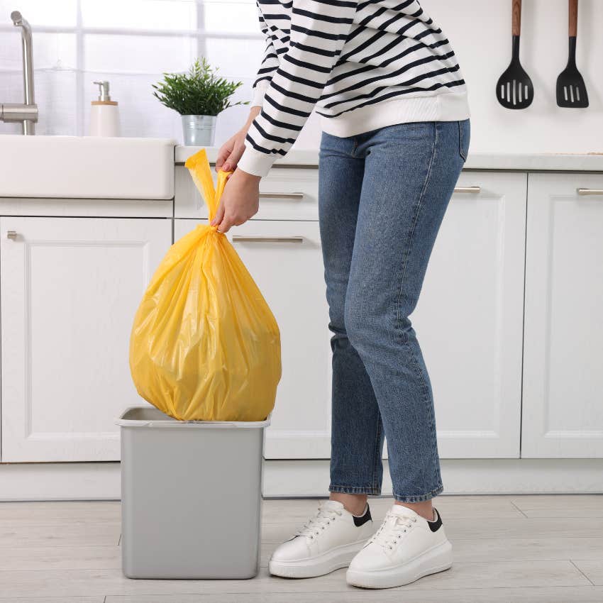 woman taking garbage out