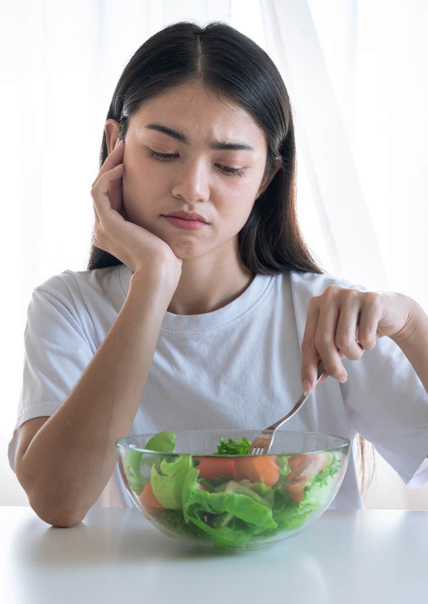 daughter following dad's diet advice and eating salad