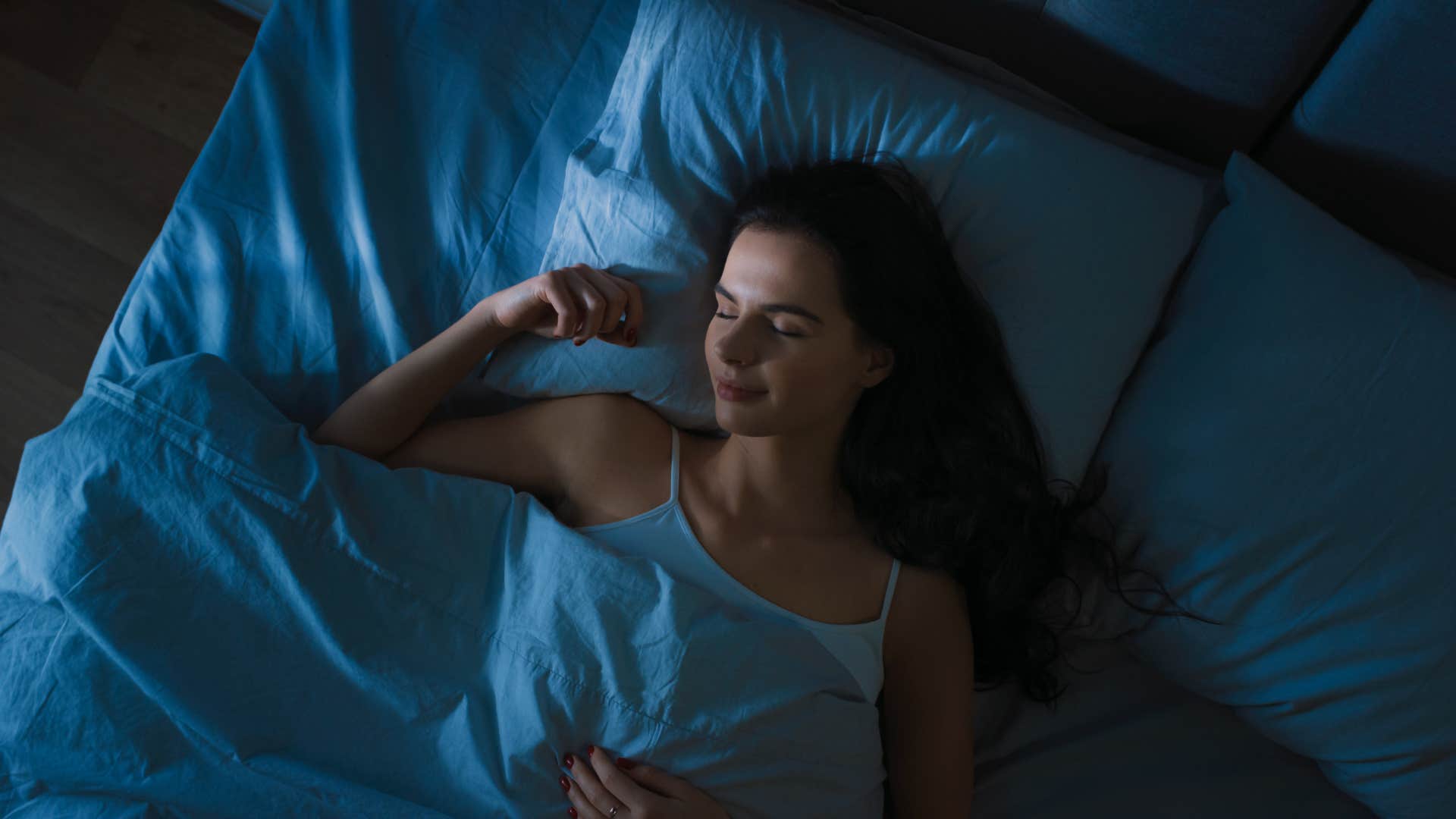 woman who is having a dream she is pregnant