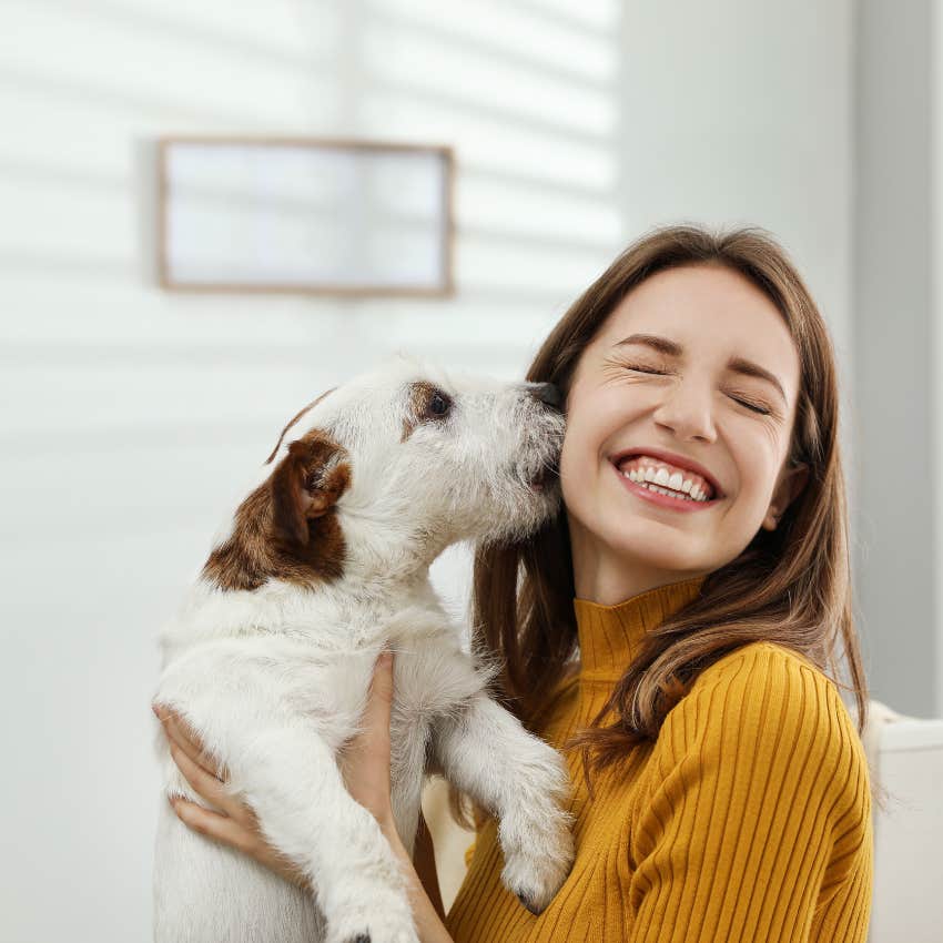 woman finding ways to feel a tiny bit happier by spending time with animals