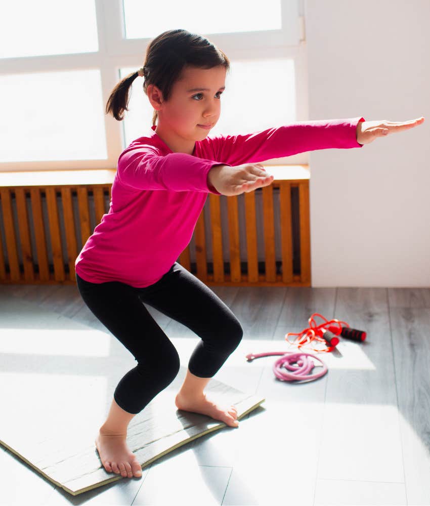 Little girl doing squats experts say exercise is not a constructive form of discipline