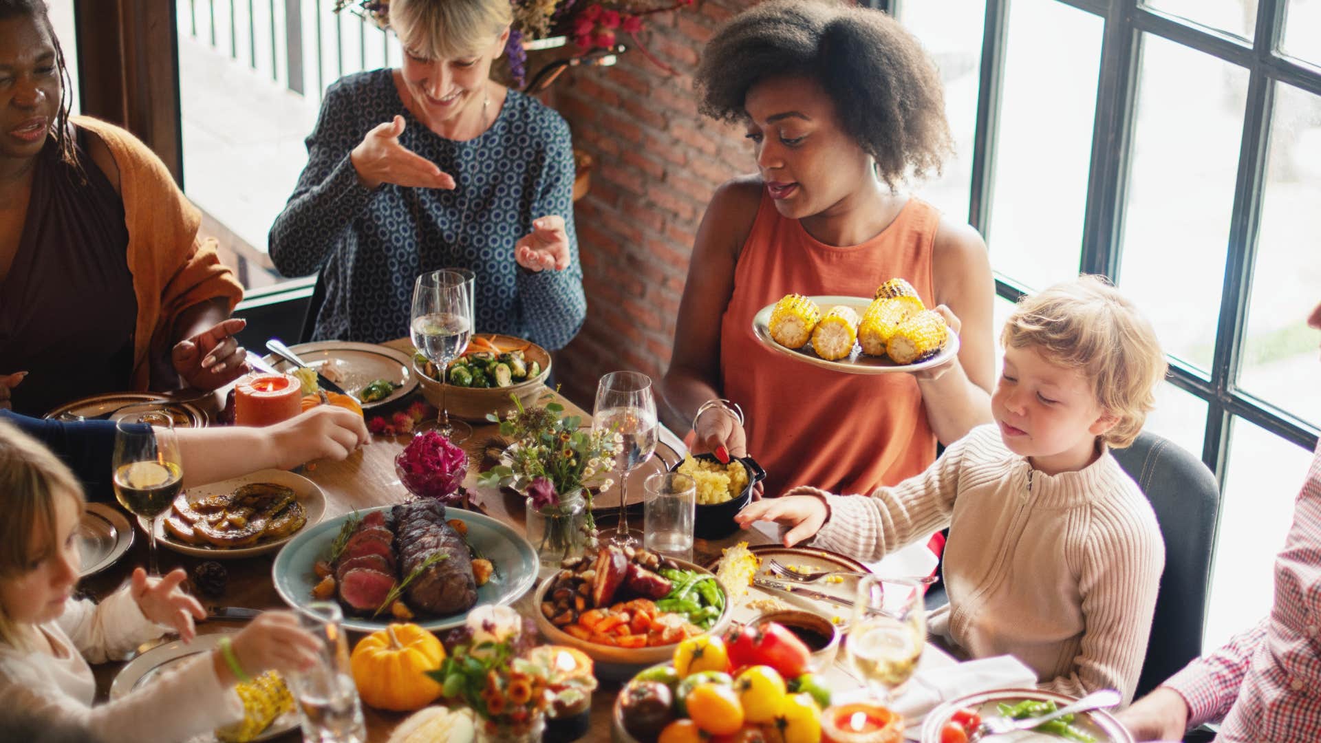 family sharing what they're thankful for at Thanksgiving dinner