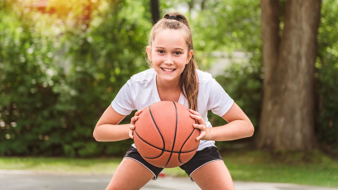 Former Pro Football Player Urges Parents Stop Raising Athletes young female athlete playing basketball